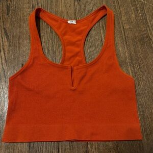 burnt orange cropped tank with a razor back & a small v in the front!🧡
